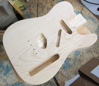 Mini Telecaster body made of ash routed and ready for finish sanding.